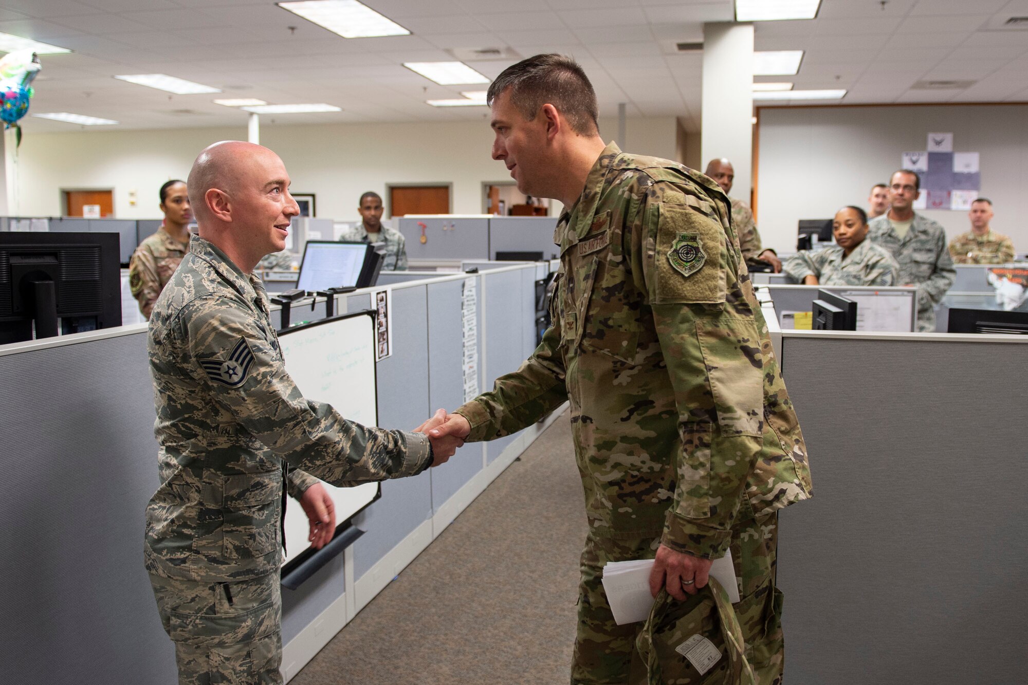 Col. Daniel Walls, right, 23d Wing commander, coins Staff Sgt. Thomas Morris, 23d Comptroller Squadron NCO in charge of financial analysis, Oct. 7, 2019, at Moody Air Force Base, Ga. Morris was recognized for   overseeing the accounting operations more than $150 million and certifying $10 million during the fourth quarter of 2019. Walls visited different components of Moody’s Wing Staff Agency to acknowledge their contributions to the mission. (U.S. Air Force photo by Airman Azaria E. Foster)