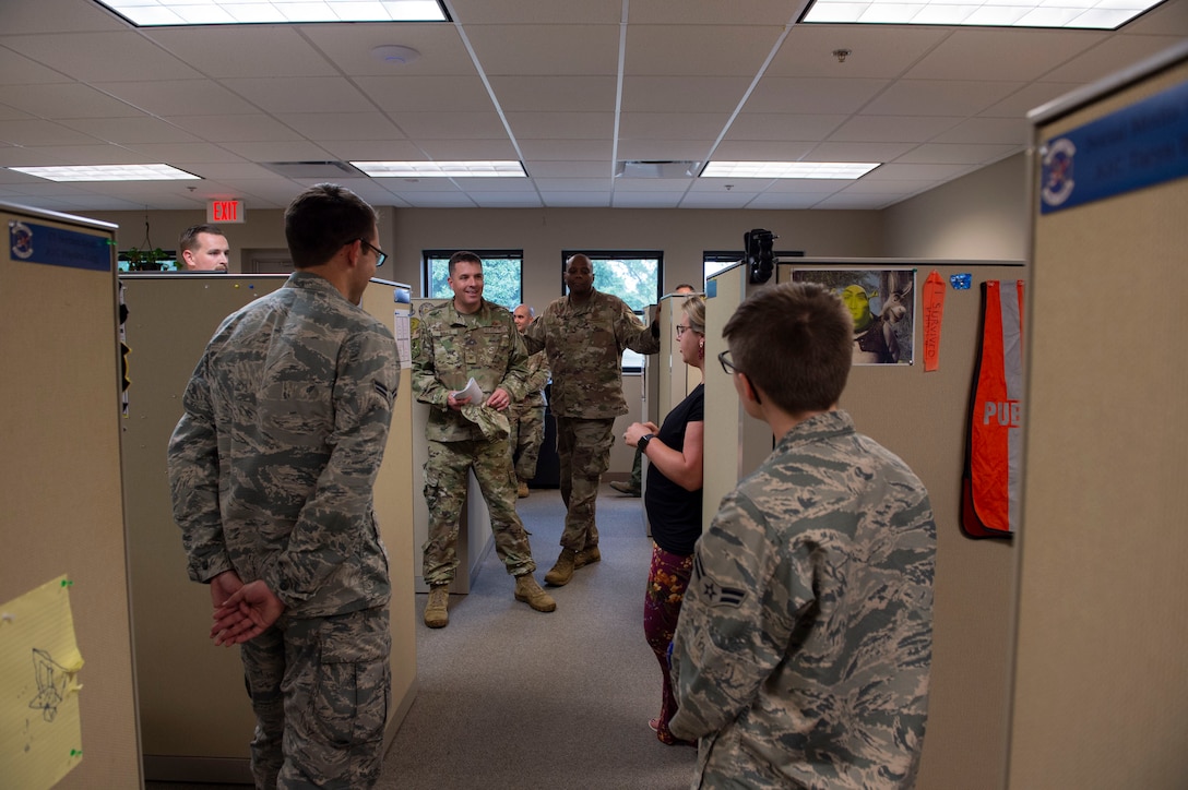 Col. Daniel Walls, 23d Wing commander, visits with Airmen assigned to the Public Affairs office Oct. 7, 2019, at Moody Air Force Base, Ga. Walls toured different components of Moody’s Wing Staff Agency to acknowledge their contributions to the mission. (U.S. Air Force photo by Airman Azaria E. Foster)