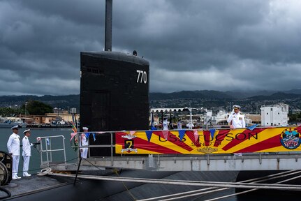 JOINT BASE PEARL HARBOR-HICKAM (Sept. 20, 2019) -- Cmdr. Chad Hardt, from Aiken, South Carolina, salutes the ensign during a change of command ceremony for the Los Angeles-class fast-attack submarine USS Tucson (SSN 770) on the submarine piers, Sept. 20. Cmdr. Douglas Pratt, from Nashua, New Hampshire, relieved Hardt as Tucson’s commanding officer. (U.S. Navy photo by Mass Communication Specialist 1st Class Michael B. Zingaro/Released)