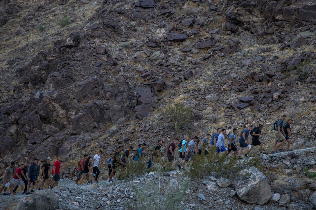 U.S. Marines with Headquarters and Headquarters Squadron (H&HS), Marine Corps Air Staiton Yuma participate in a hike up Telegraph Pass as a part of Operation Future Marine Leaders (FML) in Yuma, Ariz., Oct 4, 2019. FML consisted of the Commanding Officer and SgtMaj of H&HS hiking with the junior Marines up Telegraph Pass, conducting a professional military education (PME), and speaking to the junior Marines about becoming leaders. (U.S. Marine Corps photo by Lance Cpl. John Hall)
