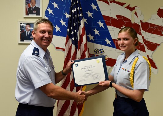 U.S. Air Force Lt. Col. Herbert Millet, 313th Training Squadron commander, presents the 315th Training Squadron Student of the Month award to Airman Tessa Greer, 315th TRS student, at Brandenburg Hall on Goodfellow Air Force Base, Texas, Oct. 4, 2019. The 315th TRS’s vision is to develop combat-ready intelligence, surveillance and reconnaissance professionals and promote an innovative squadron culture and identity unmatched across the U.S. Air Force. (U.S. Air Force photo by Airman 1st Class Zachary Chapman/Released)