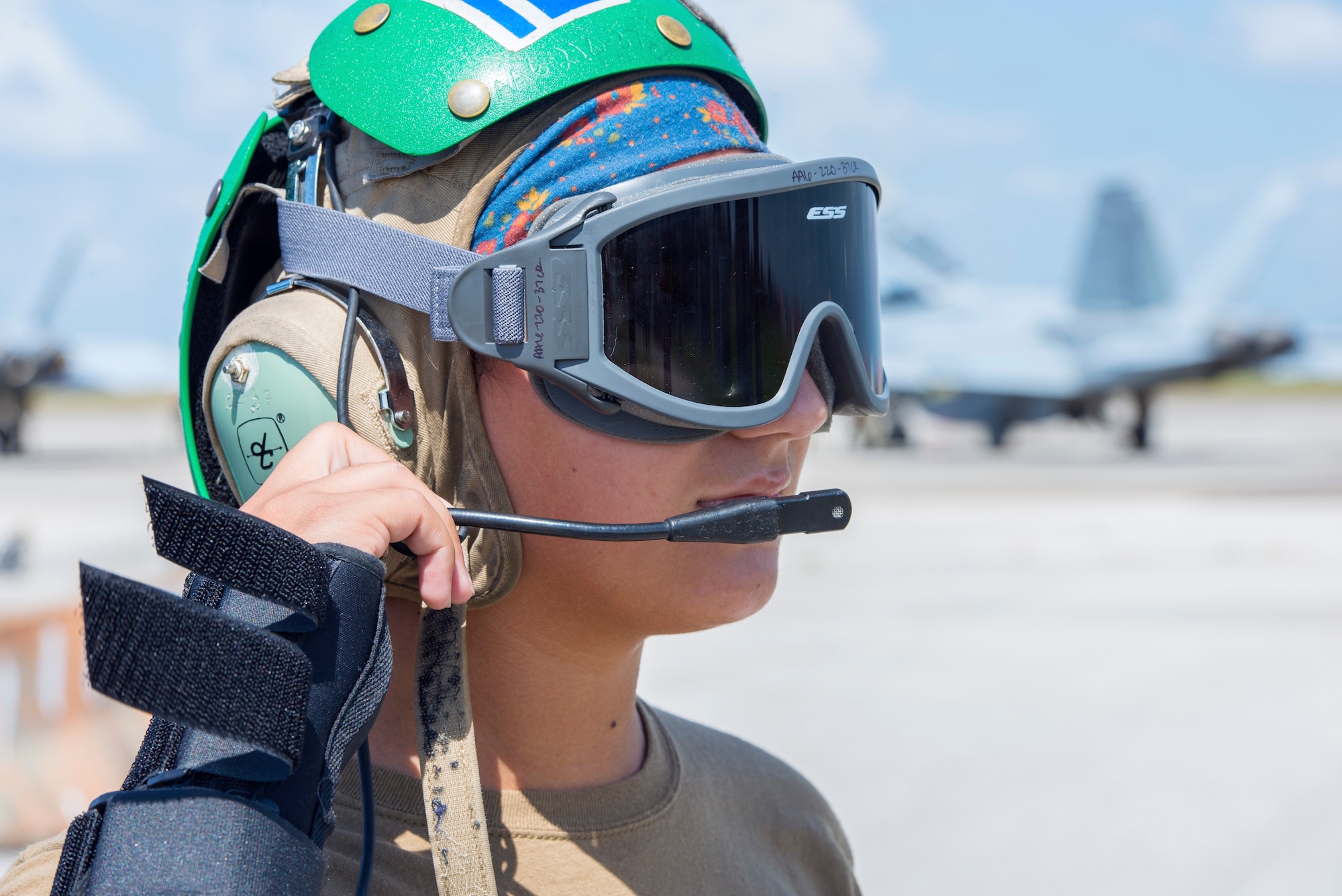 Petty Officer 3rd Class Sylvia Gonzalez, a Strike Fighter Squadron 106 aviation mechanic from Naval Air Station Oceania, Va., communicates with a fellow Sailor at MacDill Air Force Base, Fla., Oct. 1, 2019.