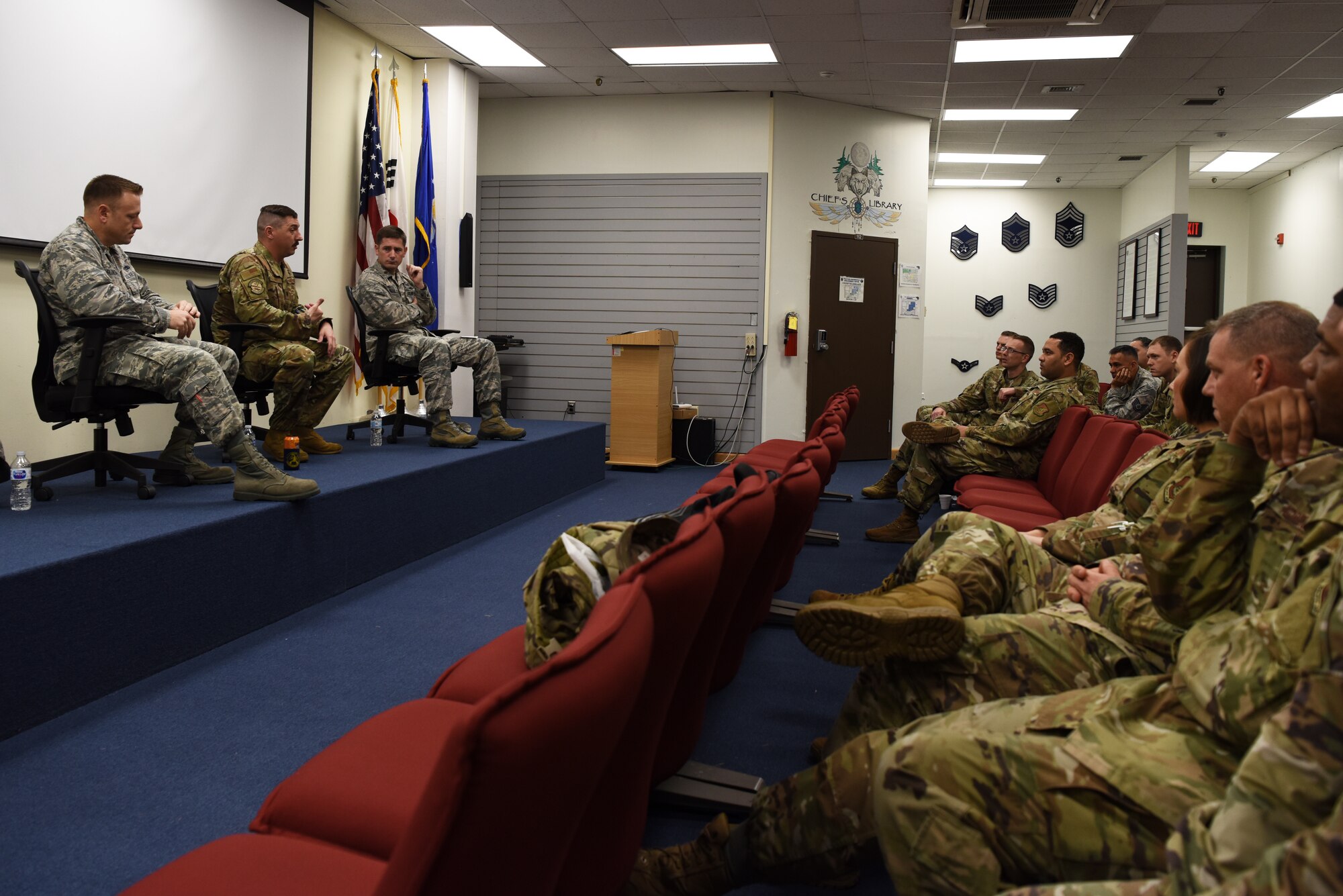 (Left) U.S. Air Force Maj. Andrew Glindmeyer, 8th Maintenance Squadron commander, Lt. Col. Jacob Foley, 8th Security Forces Squadron commander and Maj. Dustin Burleson, 8th Communications Squadron commander, answer questions from Airmen during the First Sergeant Symposium at Kunsan Air Base, Republic of Korea, Oct. 2. The commanders also talked to the Airmen about what a commander needs from their first sergeant. (U.S. Air Force photo by Staff Sgt. Joshua Edwards)