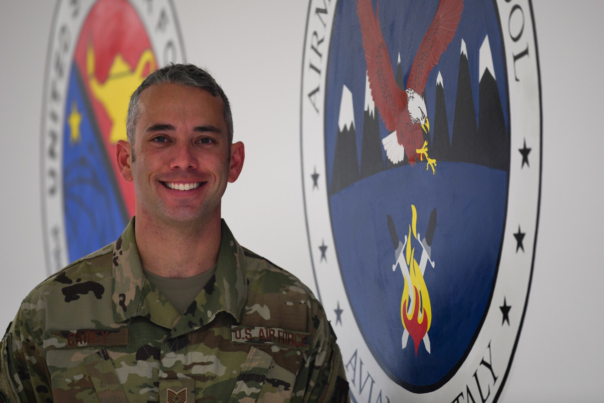 U.S. Air Force Tech. Sgt. Christopher Carey, a 31st Force Support Squadron ALS Instructor, poses for a photo, Sept. 25, 2019, at Aviano Air Base, Italy. The 31st FSS includes several distinct mission support functions that include Military Personnel, Civilian Personnel, Manpower and Organization, Airmen & Family Readiness, Education Services, Airman Leadership School and the First Term Airman Center. (U.S. Air Force photo by Airman 1st Class Ericka A. Woolever).