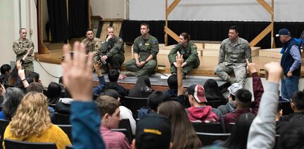 Students raise their hands to ask questions of visiting Alaska National Guard members at the Galena Interior Learning Academy Oct. 4, 2019. The Guard members were part of a small team visiting the Yukon River community to provide outreach services to veterans and build relationships for possible future Guard operations.