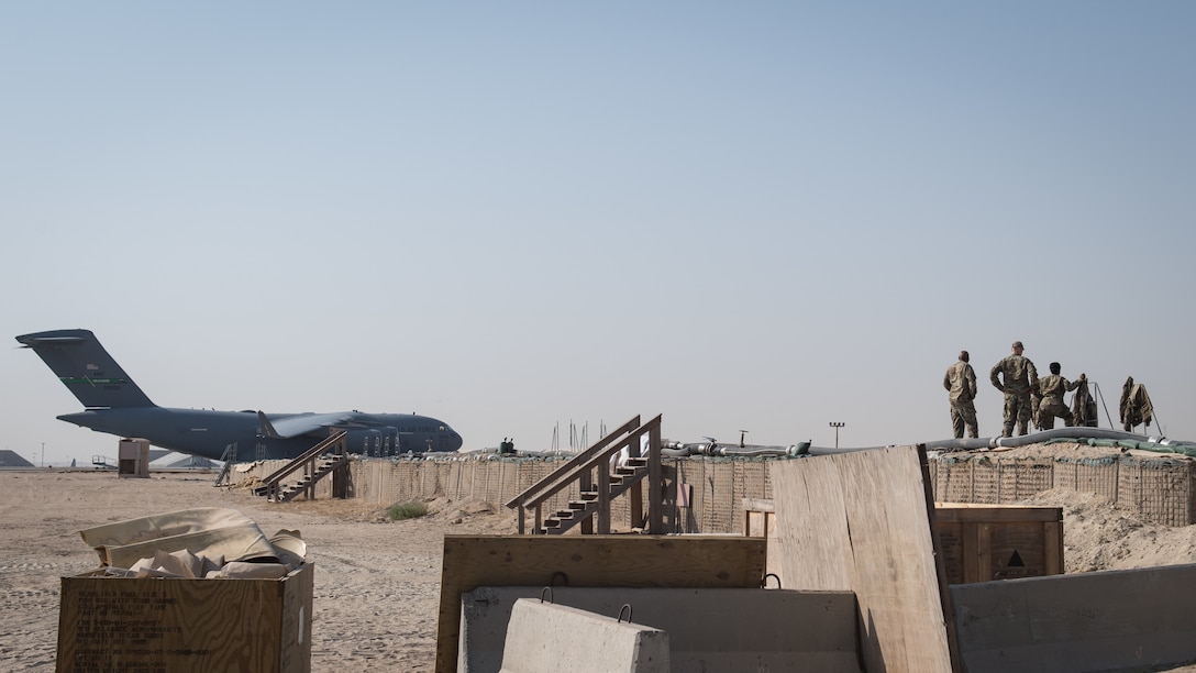 Leadership from the 386th Expeditionary Mission Support Group observe U.S. Air Force Airmen assigned to the 386th Expeditionary Logistics Readiness Squadron fuels management flight position a new empty fuel bladder in an open enclosure at Ali Al Salem Air Base, Kuwait, Oct. 7, 2019. Fuel bladders are capable of holding up to 210,000 gallons of fuel, ensuring continuous flight operations are possible and always fueled. (U.S. Air Force photo by Tech. Sgt. Daniel Martinez)