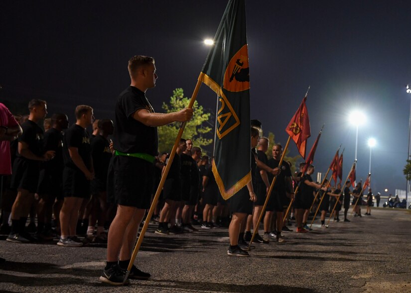 U.S. Army Soldiers stand in formation before a Breast Cancer Awareness 5K run at Joint Base Langley-Eustis, Virginia, Oct. 4, 2019.
