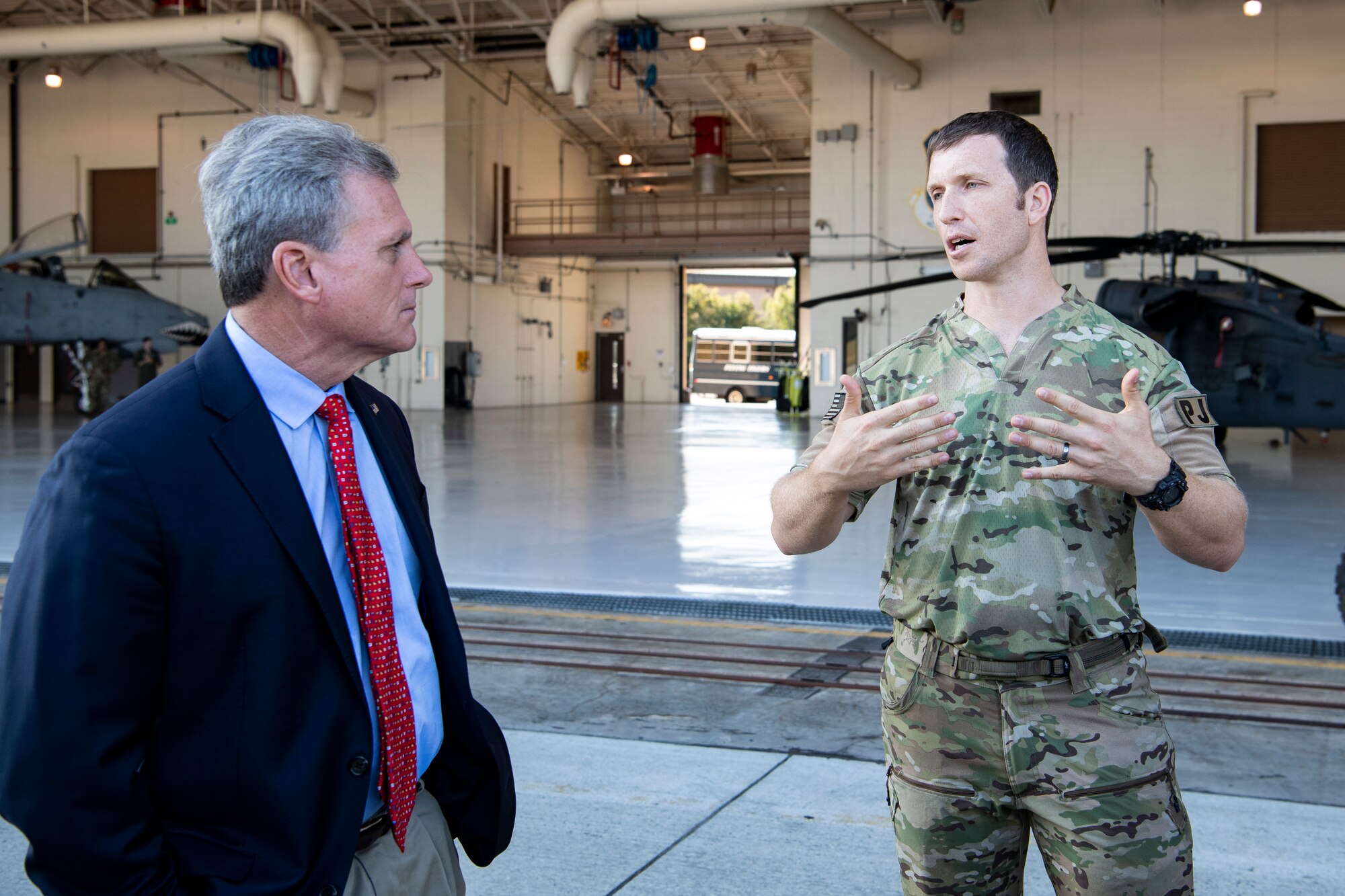 Master Sgt. Keith Aussant, 38th Rescue Squadron pararescueman, talks to U.S. Representative Buddy Carter, Georgia District 1, at Moody Air Force Base, Ga., Oct. 3, 2019. During his visit, Congressman Carter met Flying Tiger Airmen to learn about their contributions to the 23d Wing mission. (U.S. Air Force photo by Andrea Jenkins)