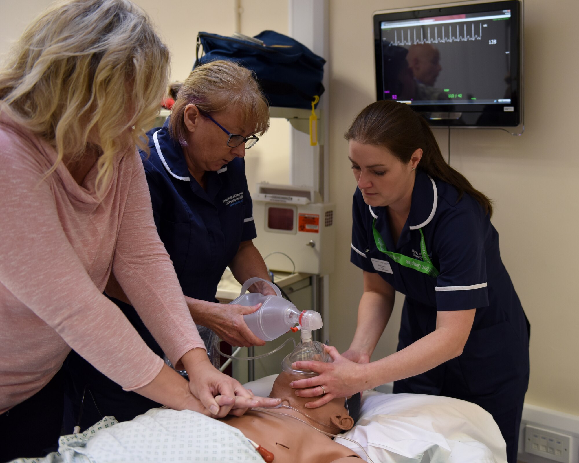 U.K. National Health Service partners practice resuscitation techniques during a hands-on training simulation as part of an immersion tour at Royal Air Force Lakenheath, England, Oct. 4, 2019. NHS medical personnel visited the Liberty Wing to participate in birth, resuscitation and combat medical simulations. (U.S. Air Force photo by Airman 1st Class Rhonda Smith)
