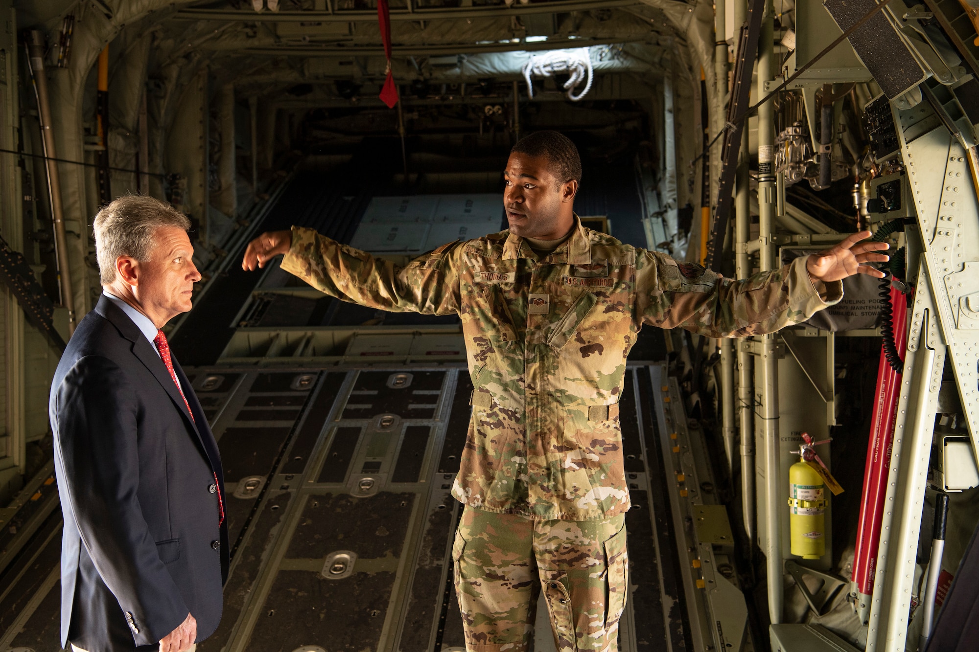 Staff Sgt. Wynthom Thomas, 71st Rescue Squadron loadmaster, explains his job on the HC-130J Combat King II to U.S. Representative Buddy Carter, Georgia District 1, at Moody Air Force Base, Ga., Oct. 3, 2019. During his visit, Congressman Carter met Flying Tiger Airmen to learn about their contributions to the 23d Wing mission. (U.S. Air Force photo by Andrea Jenkins)