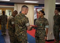 Sergeant Fay D. Stafford, a prior-service recruiter with Prior-Service Recruiting Substation Charlotte, recieves a Navy and Marine Corps Commendation medal as part of the 6th Marine Corps Distrct Offensive at the 6MCD Headquarters aboard Marine Corps Recruit Depot Parris Island, South Carolina on Sept. 23, 2019. All prior-service recruiters that went above and beyond their mission were awarded a Navy and Marine Corps Commendation medal by the 6th District Commanding Officer. (U.S. Marine Corps photo by Cpl. Jack A. E. Rigsby)