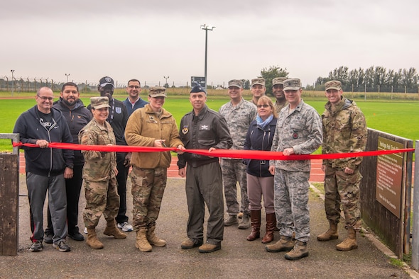 100th Air Refueling Wing leadership cuts a ribbon to mark the reopening of Heritage Park Oct. 7, 2019, at RAF Mildenhall, England. The park reopened following a six-month renovation. (U.S. Air Force photo by Airman 1st Class Joseph Barron)