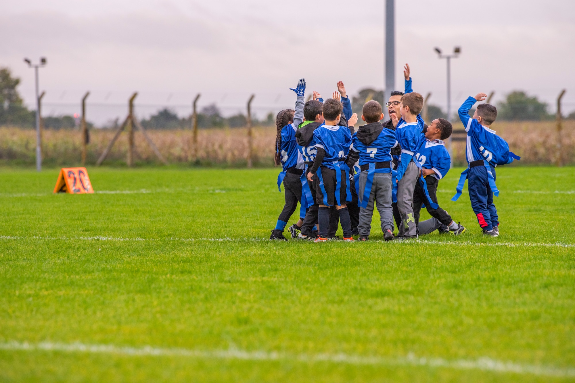 A children’s flag football team breaks from the huddle before their game at Heritage Park Oct. 7, 2019, at RAF Mildenhall, England. The park reopened following a six-month renovation. (U.S. Air Force photo by Airman 1st Class Joseph Barron)