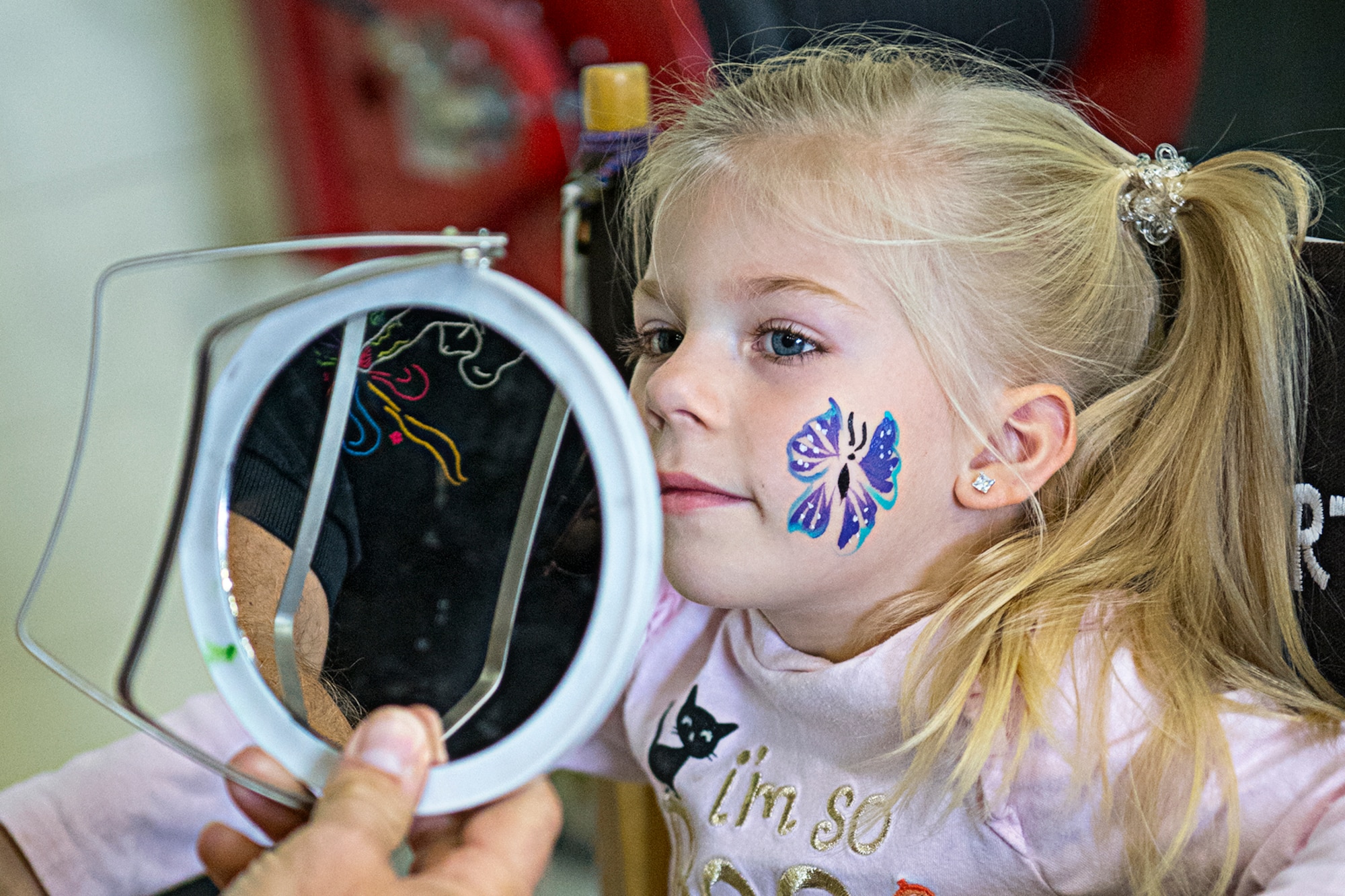 Aubrie Massey, daughter of Staff Sgt. Chris Massey, 434th Air Refueling Wing, checks out the face painter’s handiwork Oct. 5, 2019 during a fall festival at Grissom Air Reserve Base, Indiana. Unit members and their families gathered at the base to promote camaraderie and esprit de corps. (U.S. Air Force photo/Douglas Hays)