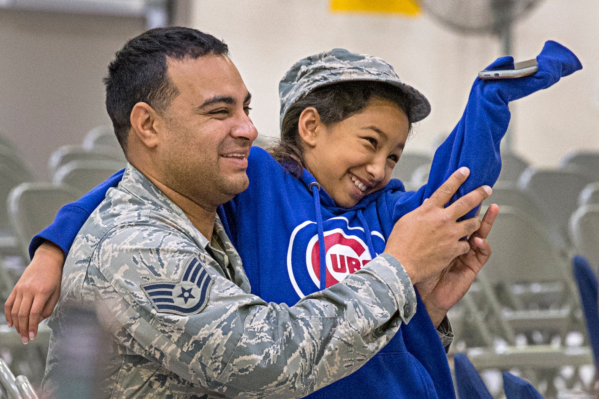 Staff Sgt. Luis Castillo, 434th Maintenance Squadron, shares laughs with his daughter Isabella Oct. 6, 2019 during the Grissom Fall Festival at Grissom Air Reserve Base, Indiana. The festival gave unit members and their families an opportunity to throttle back after a busy year of deployments, exercises, inspections and an airshow. (U.S. Air Force photo/Douglas Hays)