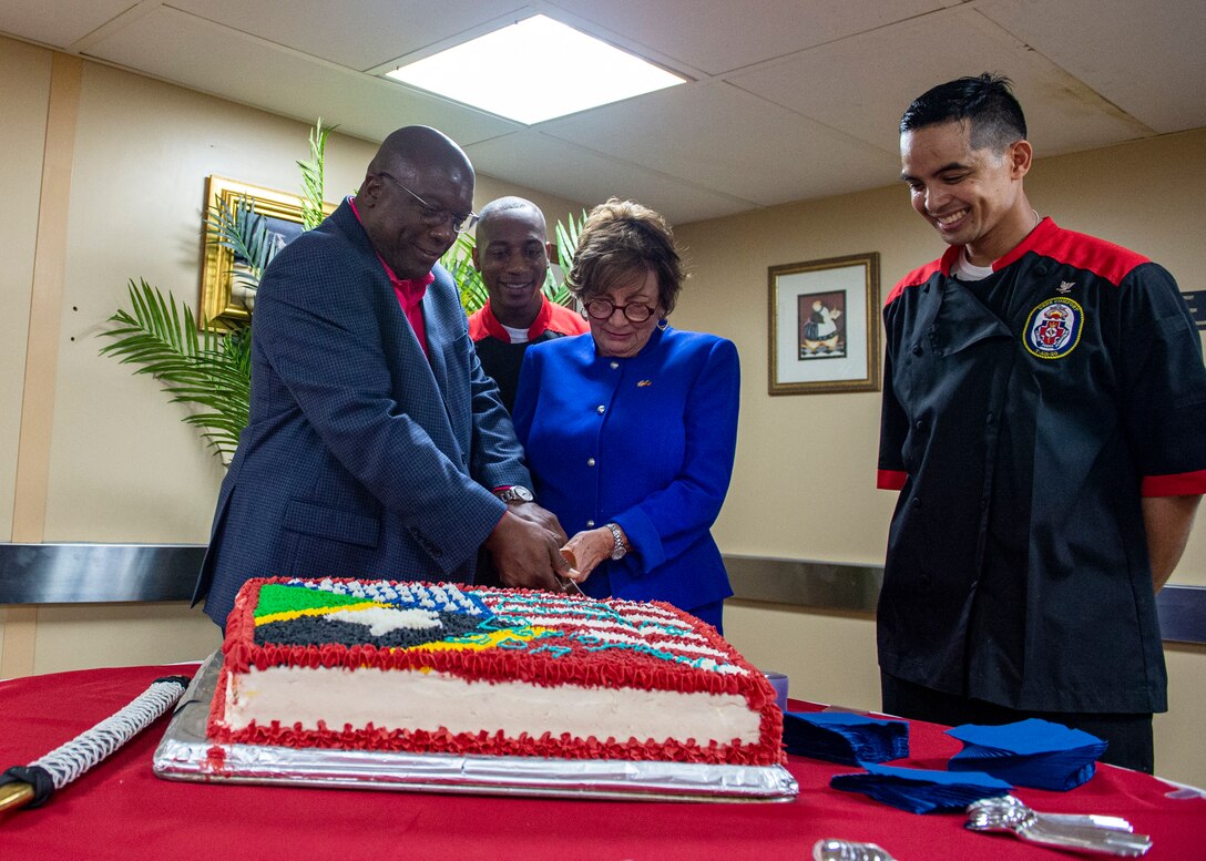 Dr. Timothy Harris, Prime Minister of St. Kitts and Nevis, visits USNS Comfort and Linda Taglialatela, U.S. ambassador to Barbados and the Eastern Caribbean, cut a cake.