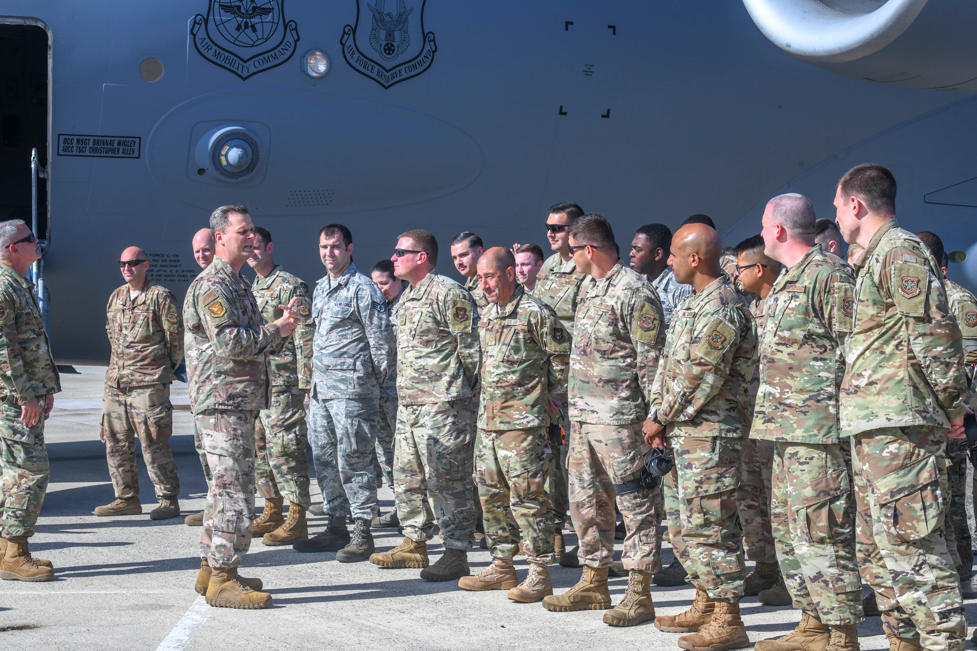 Col. Joel Safranek, 436th Airlift Wing commander, speaks to Airmen assigned to the 736th Aircraft Maintenance Squadron during a dedicated crew chief unveiling ceremony Oct. 4, 2019, at Dover Air Force Base, Del.  Tech. Sgt. Adam Olson, 736th AMXS DCC program manager, and  Tech. Sgt. Anthony Carter, 436th AMXS DCC program manager, were originally tasked with drafting the request for Air Mobility Command approval. (U.S. Air Force photo by Senior Airman Christopher Quail)