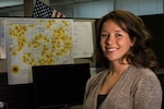 Staff Sgt. Carolyn Kinzel, C-130 Loadmaster assigned to the 164th Airlift Squadron and Ohio Air National Guard Counterdrug Task Force criminal analyst, in front of an overdose map she created Aug. 1, 2019, at the Drug Enforcement Administration (DEA) in Cleveland. The Ohio National Guard Counterdrug Task Force supports law enforcement and community organizations to help counter the drug threat.