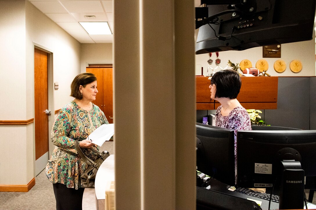 Lisa Pearce, right, 23d Wing paralegal, assists Paula Sheffield, retiree spouse, in completing her will Oct. 8, 2019, at Moody Air Force Base, Ga. The judge advocate office regularly aids retirees and military members with wills on Tuesdays. This free legal assistance provides personal and financial relief for customers and enables Airman readiness. (U.S. Air Force photo by Senior Airman Erick Requadt)