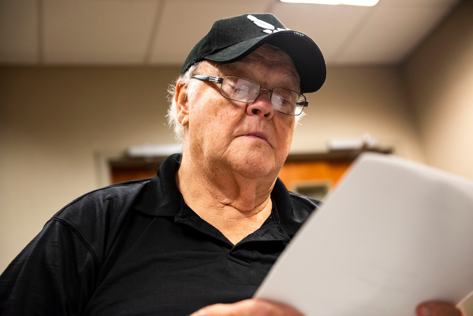 Larry Sheffield, retiree, examines his will Oct. 8, 2019, at Moody Air Force Base, Ga. The judge advocate office regularly aids retirees and military members with wills on Tuesdays. This free legal assistance provides personal and financial relief for customers and enables Airman readiness. (U.S. Air Force photo by Senior Airman Erick Requadt)