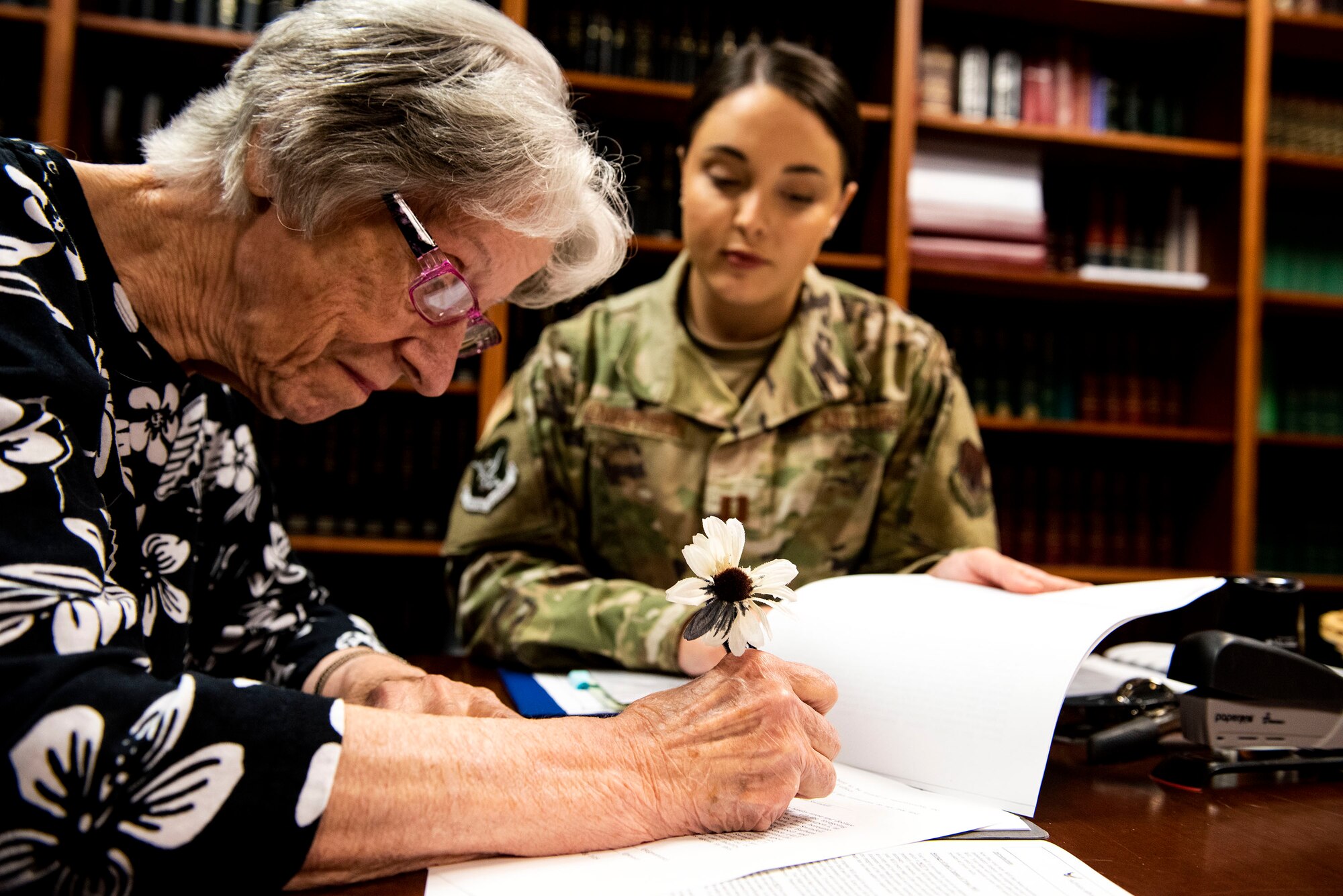 Capt. Katelynn Henderson, right, 23d Wing assistant staff judge advocate (JA), aids Barbara Swindell, retiree spouse, with her will Oct. 8, 2019, at Moody Air Force Base, Ga. JA regularly aids retirees and military members with wills on Tuesdays. This free legal assistance provides personal and financial relief for customers and enables Airman readiness. (U.S. Air Force photo by Senior Airman Erick Requadt)
