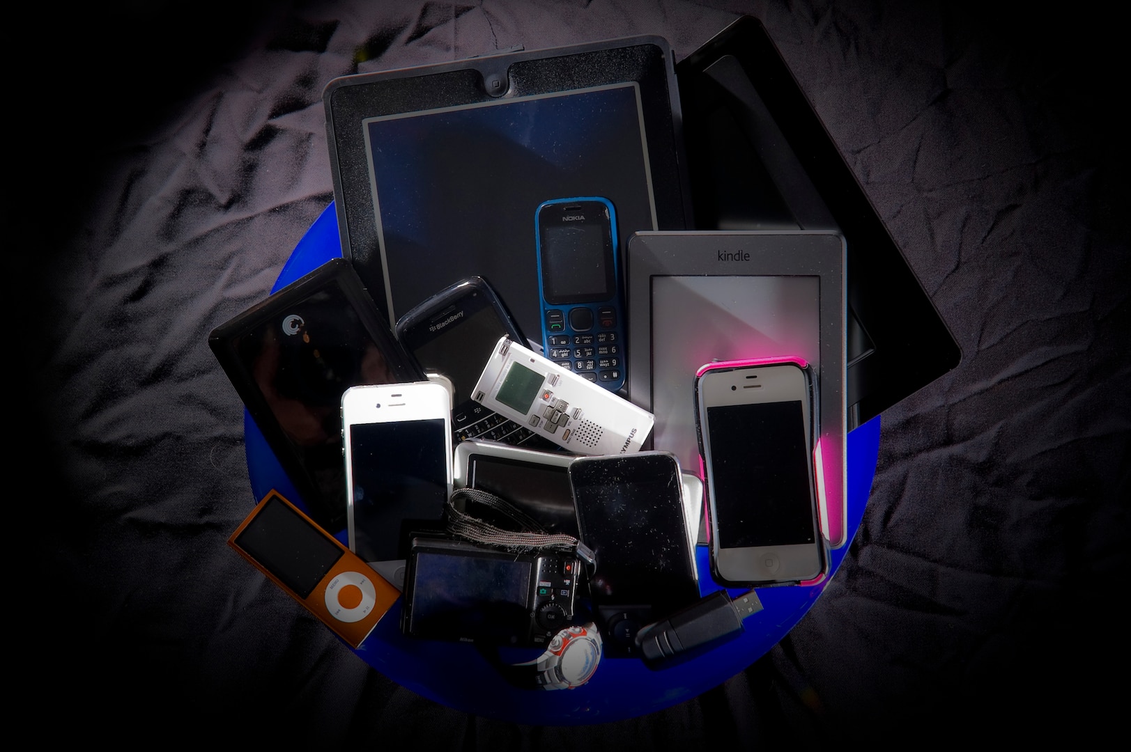 Various personal portable devices including phones and tablets.