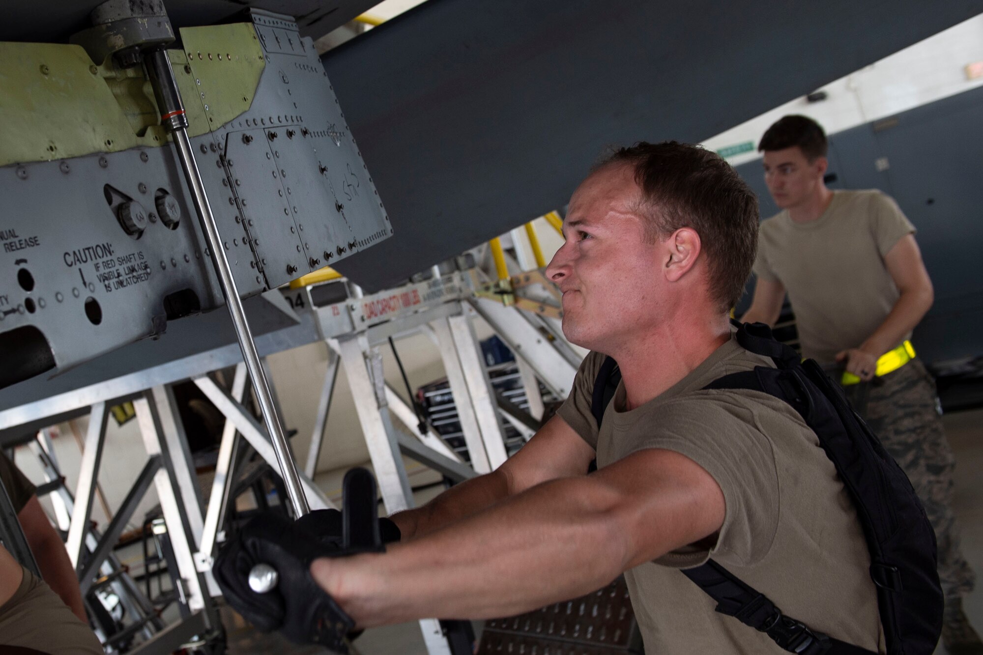 Senior Airman Mason Menke, 23d Aircraft Maintenance Squadron (AMXS) weapons load crew member, loosens a bolt during an A-10C Thunderbolt II phase inspection Oct. 8, 2019, at Moody Air Force Base, Ga. During a phase inspection, the 23d Maintenance Squadron Airmen depanel the aircraft to reach the internal workings and perform in depth examinations on A-10s after every 500 flight hours. These maintainers work day and night to ensure the aircraft are safe and reliable combat assets. (U.S. Air Force photo by Airman Azaria E. Foster)