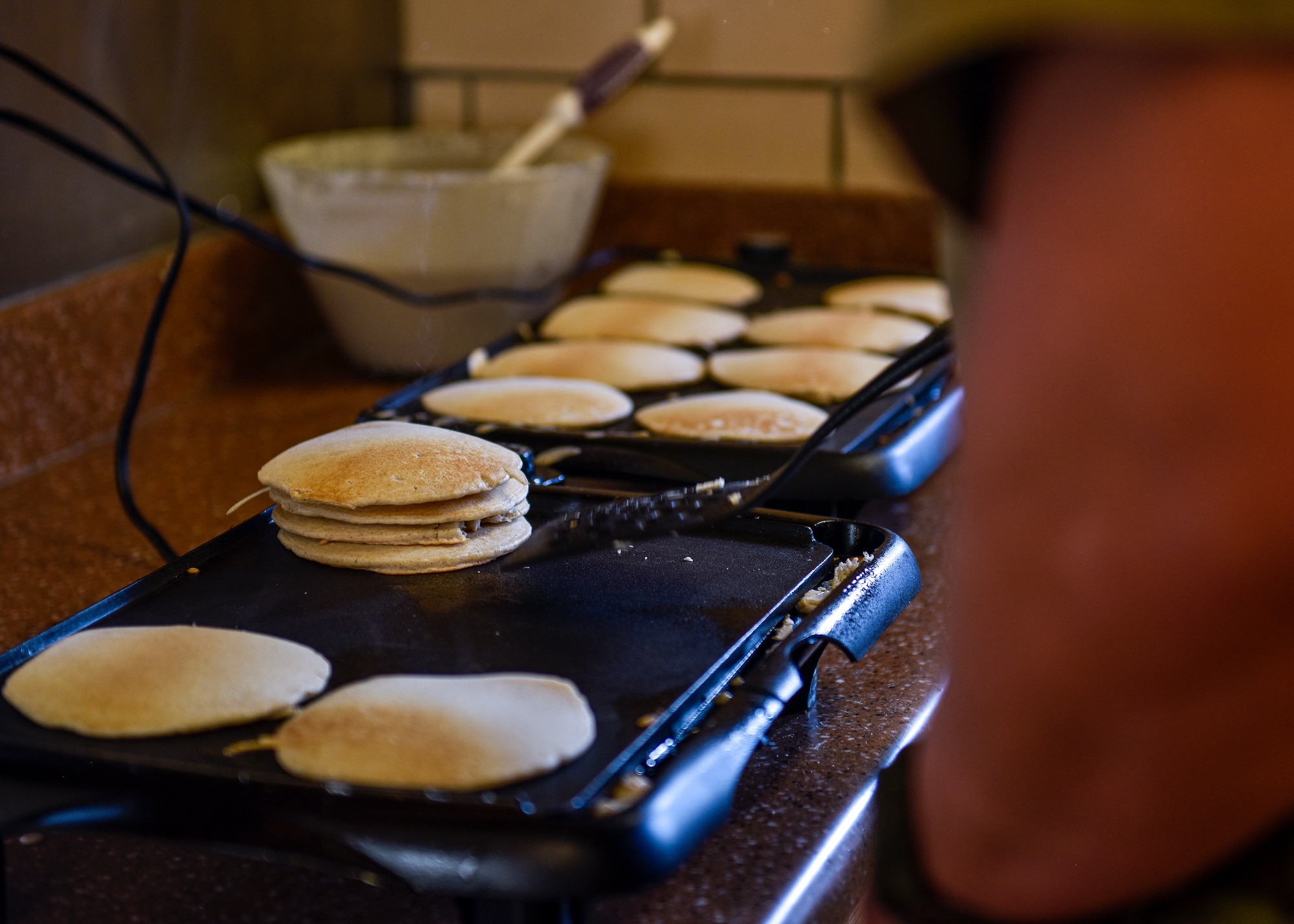 U.S. Air Force Col. David Carlson, 377th Maintenance Group commander, cooks pancakes at Kirtland Air Force Base, Oct. 7, 2019. The Combined Federal Campaign fundraising goal for 2019 at Kirtland AFB is $126,000. (U.S. Air Force photo by Airman 1st Class Austin J. Prisbrey)