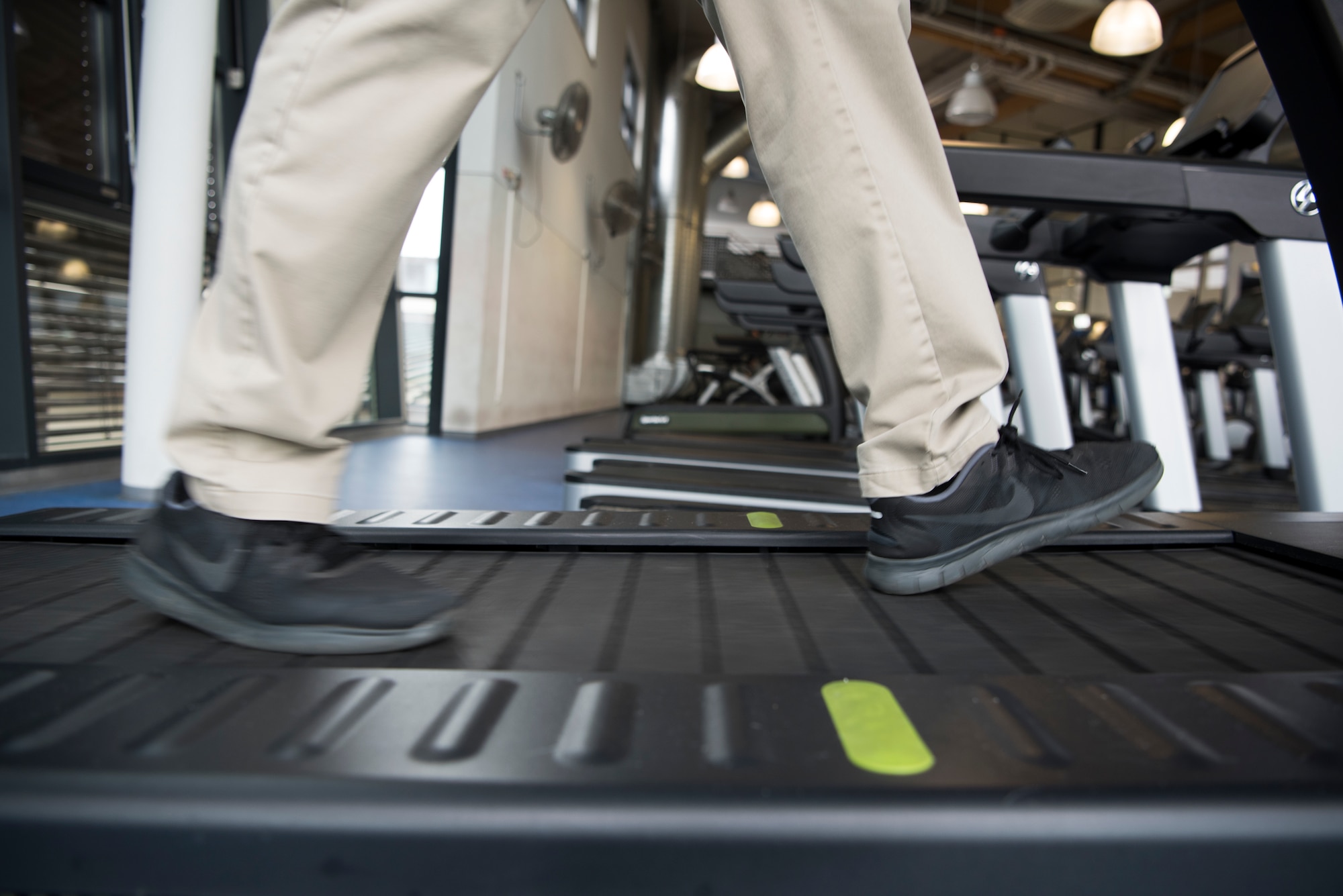 Master Sgt. Joseph McTaggart, non-commissioned officer in charge of Ramstein Air Base Southside Fitness Center walks on one of the new environmentally friendly treadmills at the Southside fitness center on Ramstein Air Base, Germany, Oct. 4, 2019. The treadmill functions entirely on the individuals own energy. As the individual moves, the treadmill transfers the individuals energy into usable energy which is put back into the power grid.