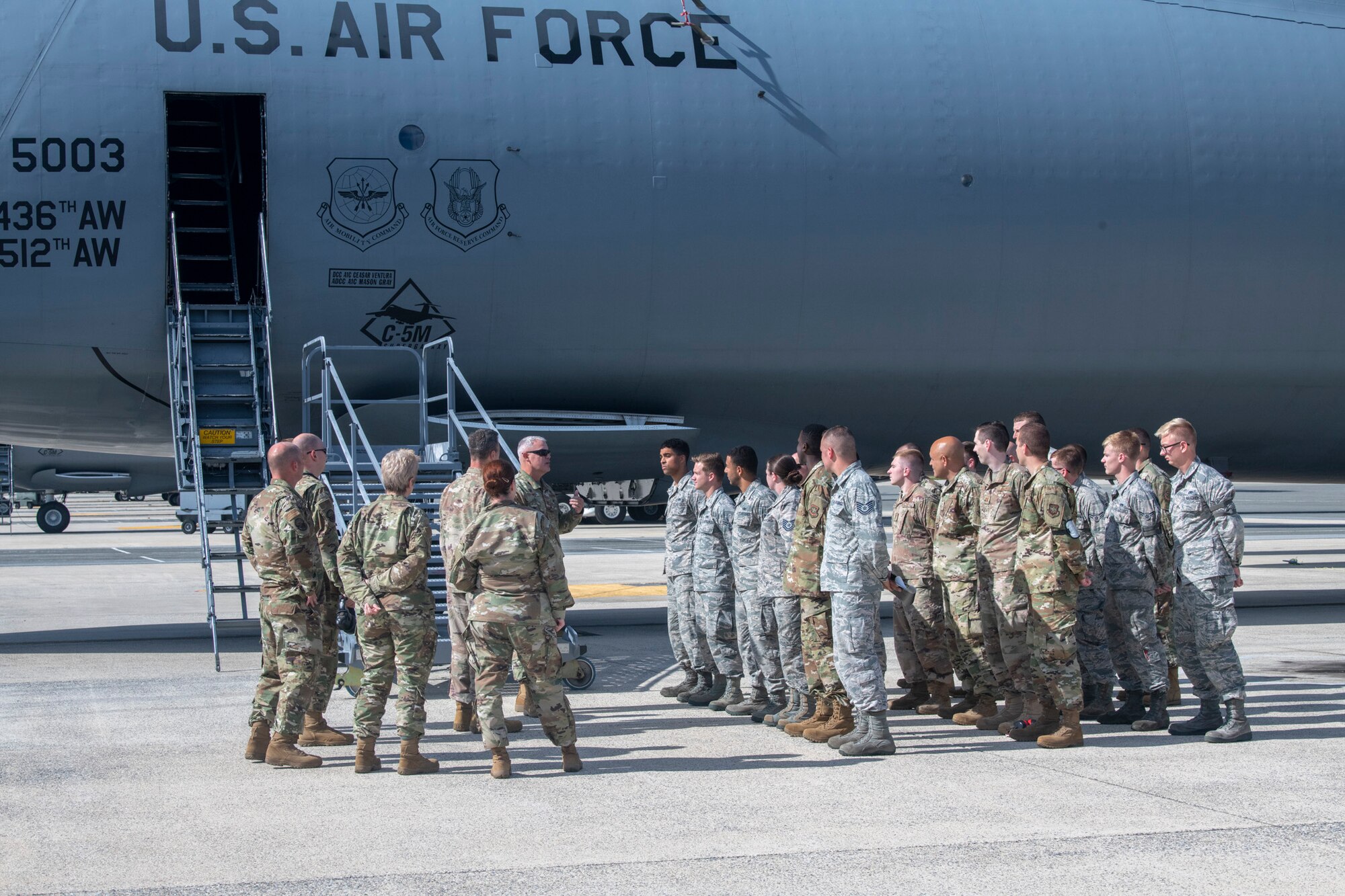Col. Christopher May, 436th Maintenance Squadron commander, speaks to Airmen assigned to the 436th Aircraft Maintenance Squadron during a dedicated crew chief unveiling ceremony Oct. 4, 2019, at Dover Air Force Base, Del. Prior to this event, May recommended that Major Scholz, 736th Aircraft Maintenace Squadron commander, work with his C-5 sister squadron to submit a combined request to AMC.  (U.S. Air Force photo by Senior Airman Christopher Quail)