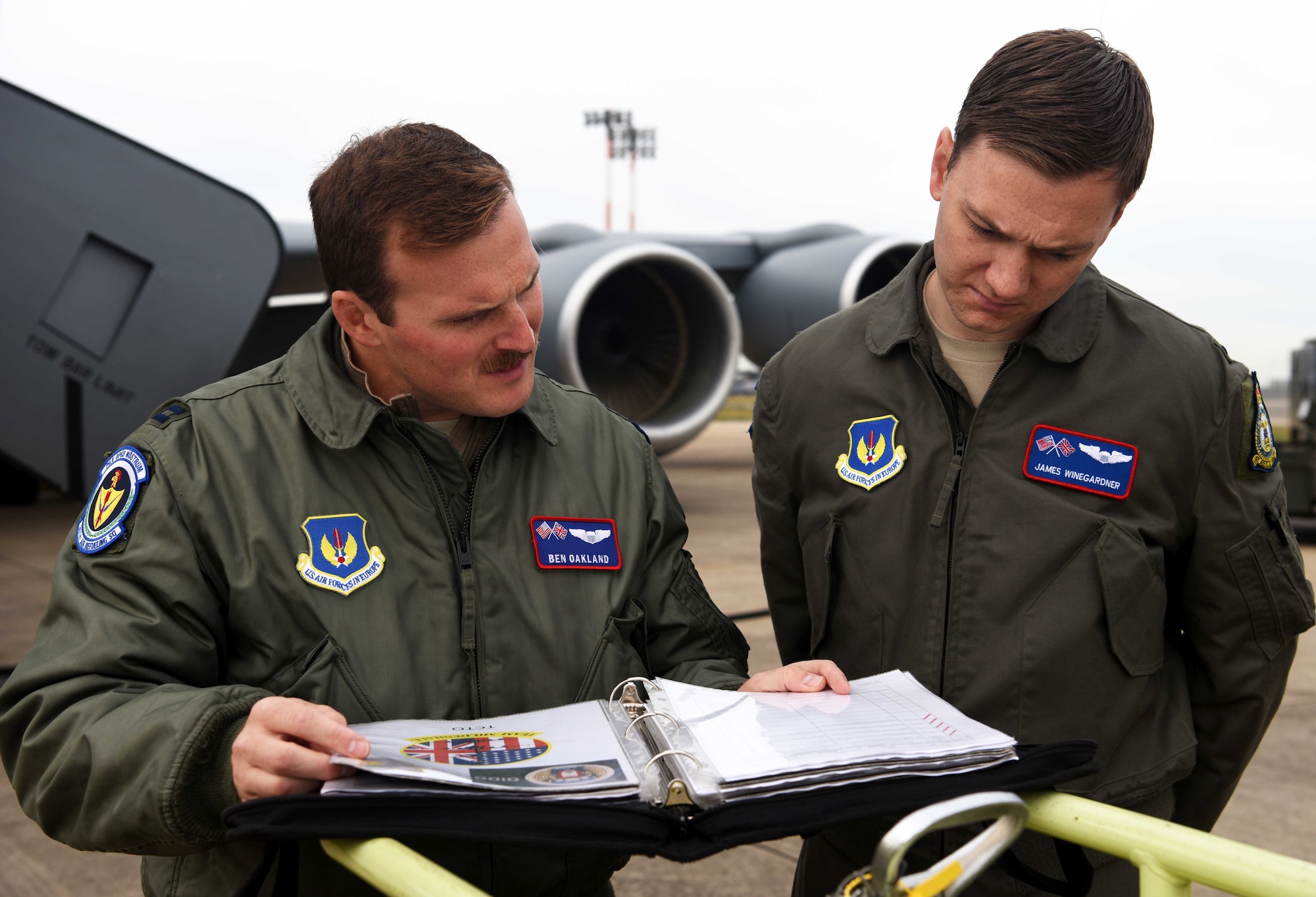 Capt. Ben Oakland, 351st Air Refueling Squadron aircraft commander, and 1st Lt. James Winegardner, 351st Air Refueling Squadron co-pilot, look over pre-flight checklists prior to takeoff during a readiness exercise at RAF Mildenhall, England, Oct. 3, 2019. Exercise scenarios were designed to ensure 100th ARW Airmen were fully prepared for potential contingencies in the wing’s area of responsibility. (U.S. Air Force photo by Airman 1st Class Brandon Esau)