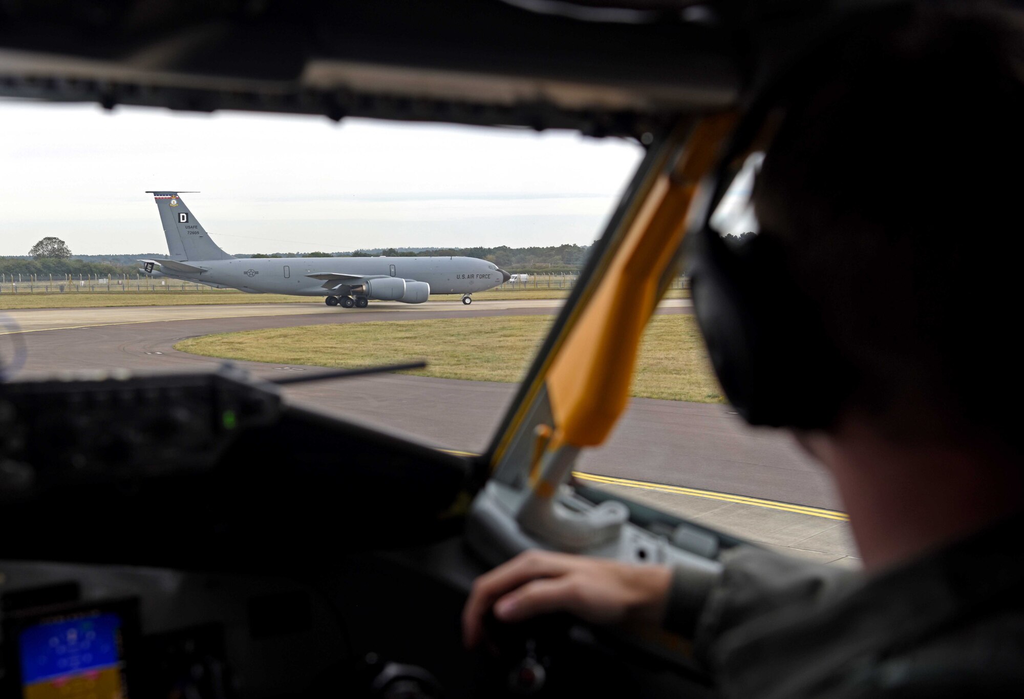 1st Lt. James Winegardner, 351st Air Refueling Squadron pilot, looks on as a KC-135 Stratotanker assigned to the 100th Air Refueling Wing begins to taxi during a readiness exercise at RAF Mildenhall, England, Oct. 3, 2019. Exercise scenarios were designed to ensure 100th ARW Airmen were fully prepared for potential contingencies in the wing’s area of responsibility. (U.S. Air Force photo by Airman 1st Class Brandon Esau)