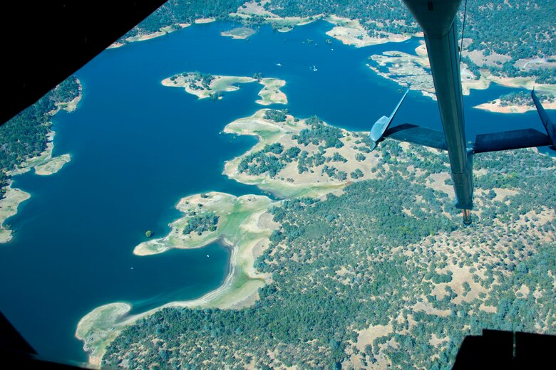 A KC-10 Extender boom is displayed Oct. 6, 2019, while flying over Folsom Lake near Sacramento, California. The KC-10 Extender performed a flyover for the 2019 California Capital Airshow in Sacramento. The airshow is an annual event honoring the Sacramento region’s veterans and aviation heritage. (U.S. Air Force photo by Senior Airman Jonathon Carnell)