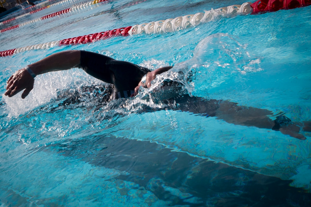 U.S. Marine Corps Capt. Kristopher Ulbrich, operations officer with Headquarters Company, Combat Logistics Regiment 3, competes in the swimming portion of the 2019 Futenma Triathlon on Marine Corps Air Station Futenma, Okinawa, Japan, Oct. 6, 2019. The triathlon is held in order to strengthen the relationship between U.S. service members and residents of Okinawa through athletic events. (U.S. Marine Corps photo by Cpl. Samuel Brusseau)