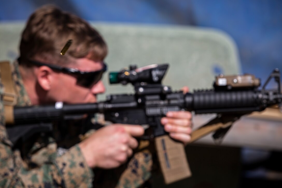 A U.S. Marine with Special Purpose Marine Air-Ground Task Force - Crisis Response - Africa 20.1, Marine Forces Europe and Africa, fires an M4 carbine during a battle-sight zero at a shooting range in Sigonella, Italy, Oct. 4, 2019.