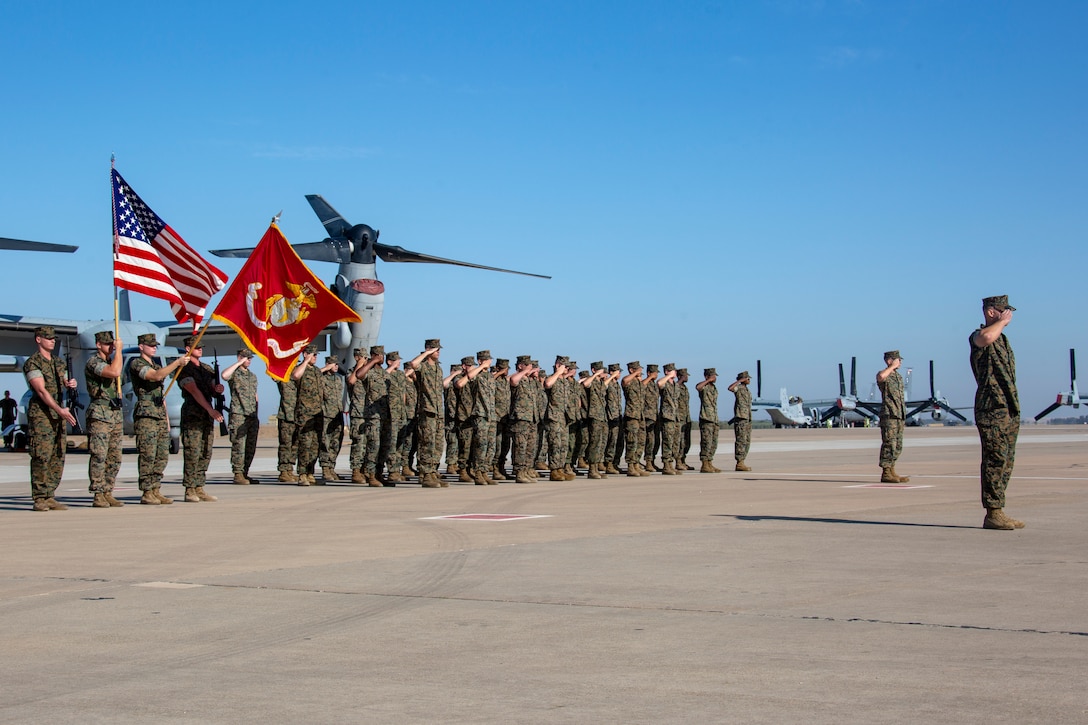 U.S. Marines with Special-Purpose Marine Air-Ground Task Forse-Crisis Response-Africa 19.2 and 20.1 salute for the national anthem in formation during a transfer of authority ceremony at Morón Air Base, Spain, Oct. 1, 2019.