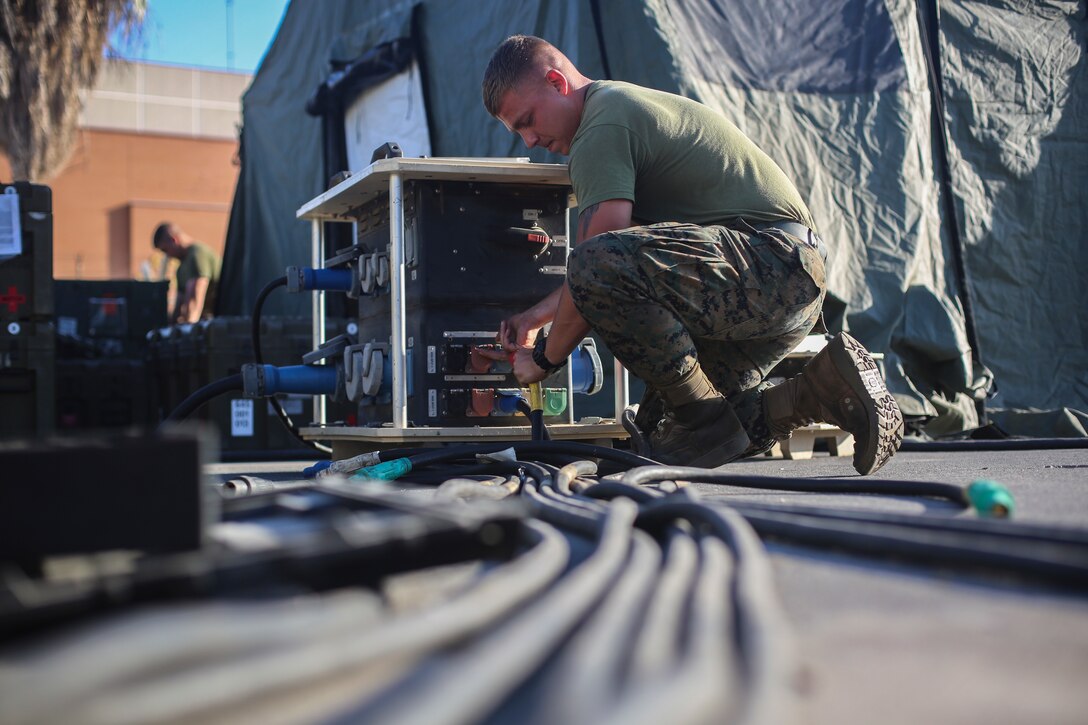 A U.S. Marine with Special Purpose Marine Air-Ground Task Force - Crisis Response - Africa 20.1, Marine Forces Europe and Africa, disassembles a forward resuscitative surgical system at Naval Air Station Sigonella, Italy, Oct. 1, 2019.