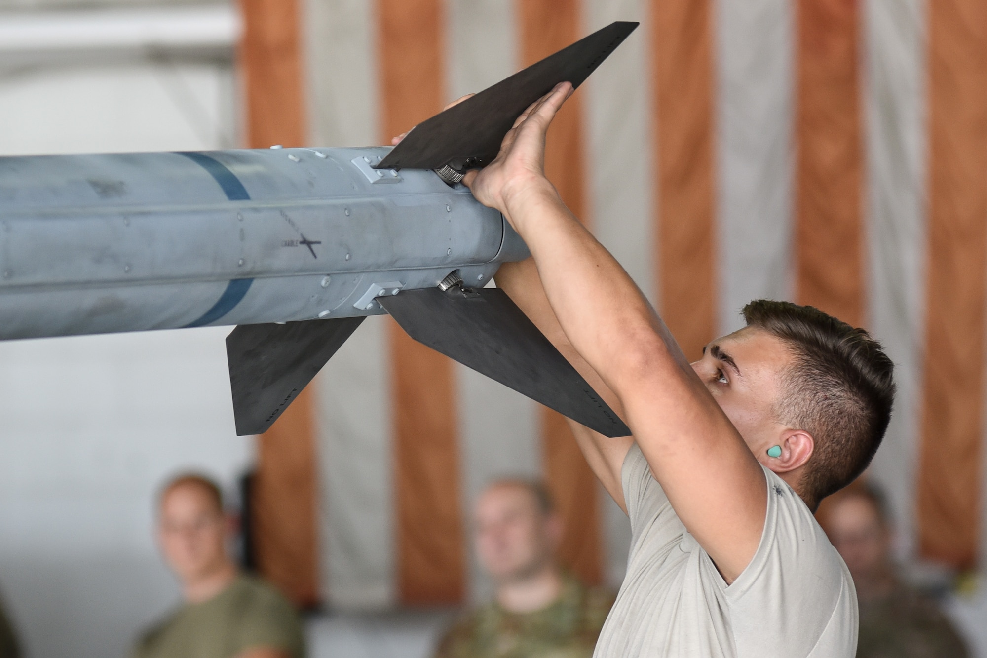 U.S. Air Force Airman 1st Class Tylan Armstrong, 55th Aircraft Maintenance Unit (AMU) load crew member, examines fins for a munition during the quarterly load crew competition at Shaw Air Force Base, South Carolina, Oct. 7, 2019.