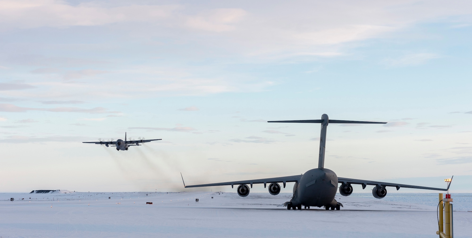 A C-130 flown by Airmen from the New York Air National Guard's 109th Airlift Wing takes off from Canadian Forces Station Alert on Ellsmere Island, Nunavut, after dropping off supplies on Sept. 30, 2019. The Air Guard crew assisted members of the Royal Canadian Air Force's  8 Wing in transporting supplies from Thule Air Base, Greenland to Canadian Forces Station Alert, Nunavut. (Courtesy Photo)