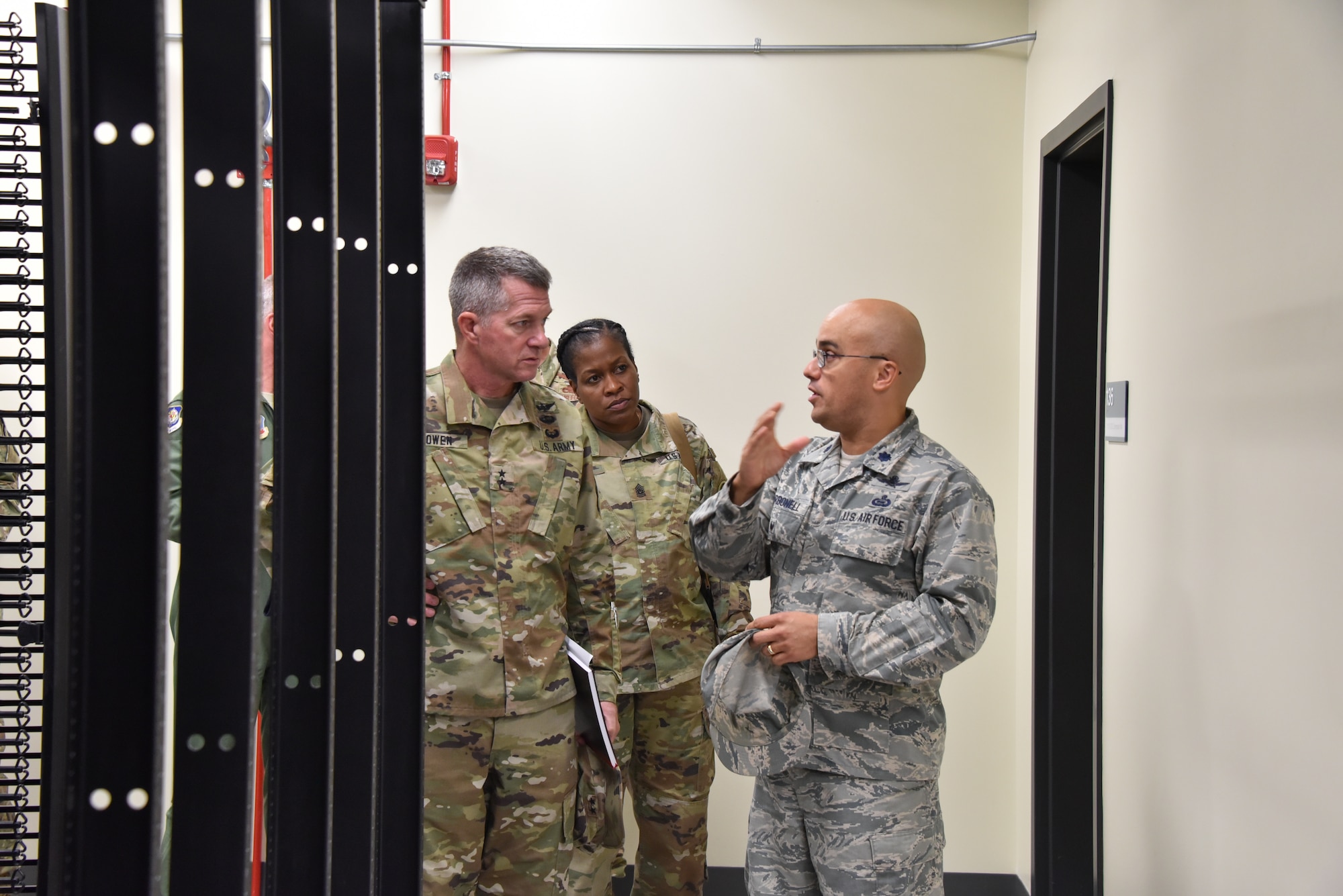 U.S. Air Force Lt. Col. Joed Carbonell, 175th Cyberspace Operations Group deputy commander, gives U.S. Army Maj. Gen. Timothy E. Gowen, adjutant general for Maryland, a tour of the new cyber building Oct. 6, 2019 during his initial visit to the Maryland Air National Guard’s 175th Wing in Middle River, Md.