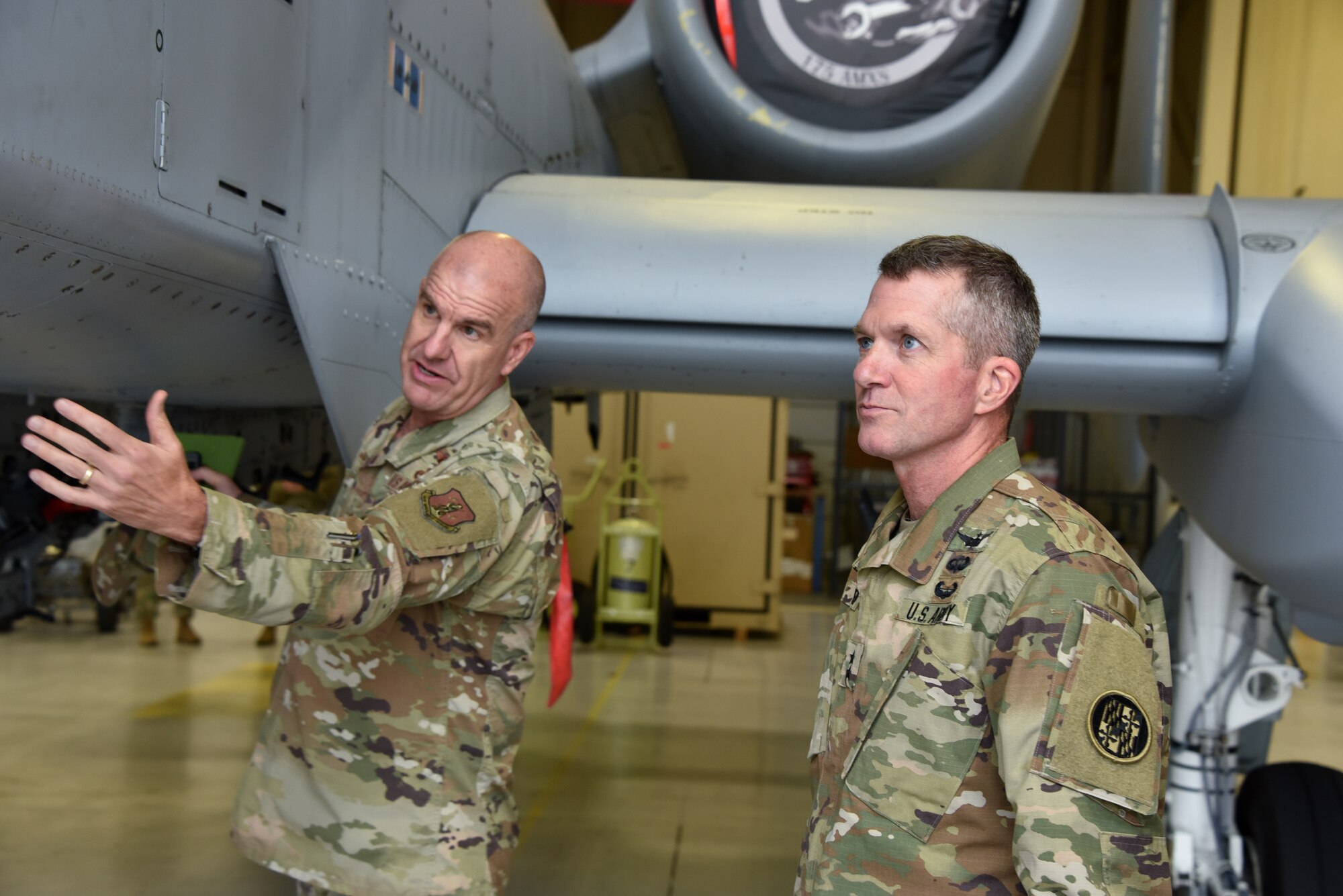 U.S. Air Force Brig. Gen. Edward Jones, Maryland’s assistant adjutant general for Air, gives U.S. Army Maj. Gen. Timothy E. Gowen, adjutant general for Maryland, a tour of an A-10C Thunderbolt II aircraft hangar Oct. 6, 2019 during his initial visit to the Maryland Air National Guard’s 175th Wing in Middle River, Md.