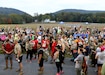 Participants gather at the start of the eighth annual March for the Fallen event Sept. 28, 2019 on Strickler Field at Fort Indantown Gap, Pa. Many participants took time to observe the Wall of Remembrance, which depicts 47 fallen Pennsylvania service members. (U.S. Army National Guard photo by Sgt. 1st Class HollyAnn Nicom)
