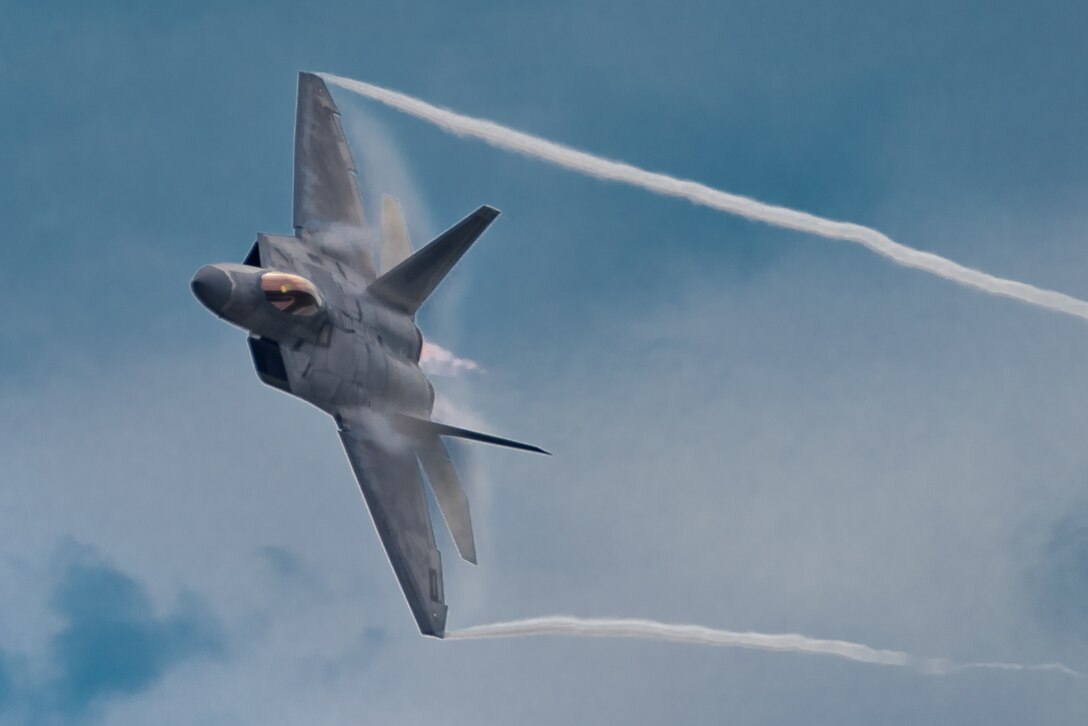 U.S. Air Force Maj. Paul Lopez, F-22 Demo Team commander, performs the dedication pass during the Spirit of St. Louis Air Show Sept. 7, 2019. Representing the U.S. Air Force and Air Combat Command, the F-22 Demo Team travels to 25 air shows a season to showcase the performance and capabilities of the world's premier 5th-generation fighter. (U.S. Air Force photo by 2nd Lt. Sam Eckholm)