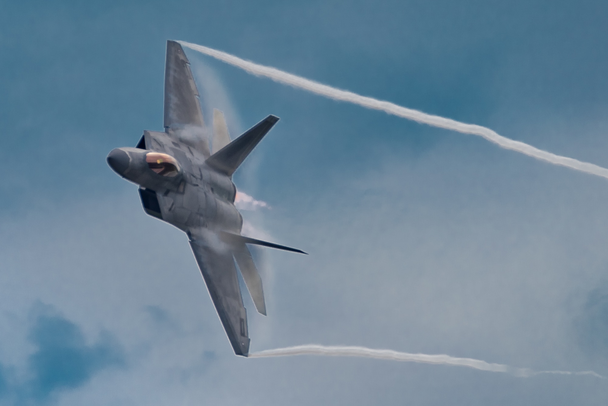 U.S. Air Force Maj. Paul Lopez, F-22 Demo Team commander, performs the dedication pass during the Spirit of St. Louis Air Show Sept. 7, 2019. Representing the U.S. Air Force and Air Combat Command, the F-22 Demo Team travels to 25 air shows a season to showcase the performance and capabilities of the world's premier 5th-generation fighter. (U.S. Air Force photo by 2nd Lt. Sam Eckholm)