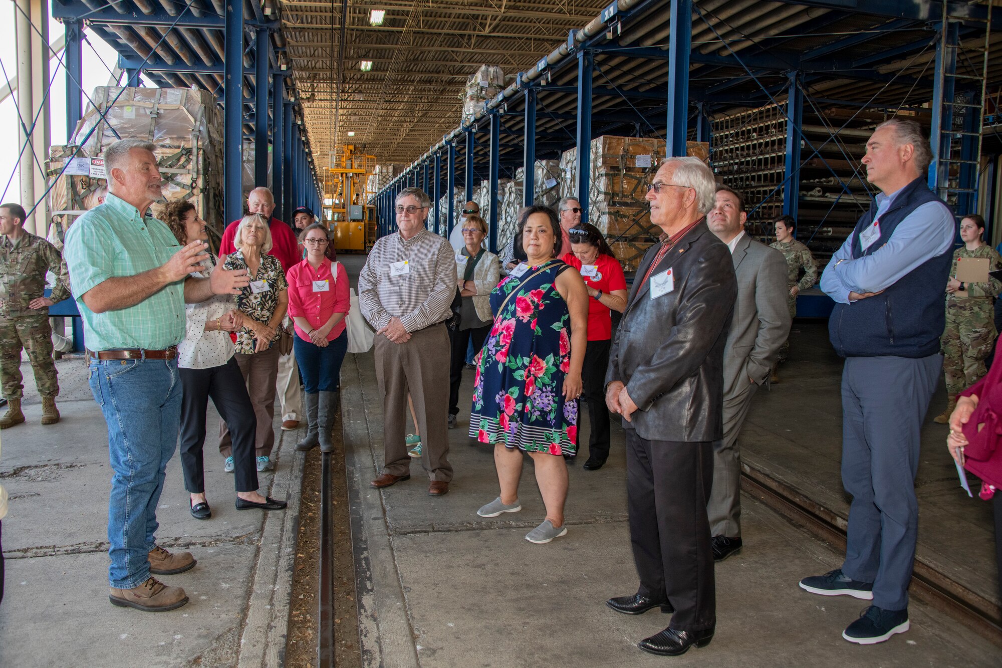 Richard Saleck, left, 60th Aerial Port Squadron air freight operations manager, briefs Travis AFB Honorary Commanders during a tour through the 60th APS warehouse Oct. 4, 2019 at Travis Air Force Base, California. The purpose of the Honorary Commanders Program is to promote relationships between base senior leadership and civilian partners, foster civic appreciation of the Air Force mission and its Airmen, maximize opportunities to share the Air Force story with new stewards and to communicate mutual interest, challenges and concerns senior leaders and civilian stakeholders have in common. (U.S. Air Force photo by Heide Couch)
