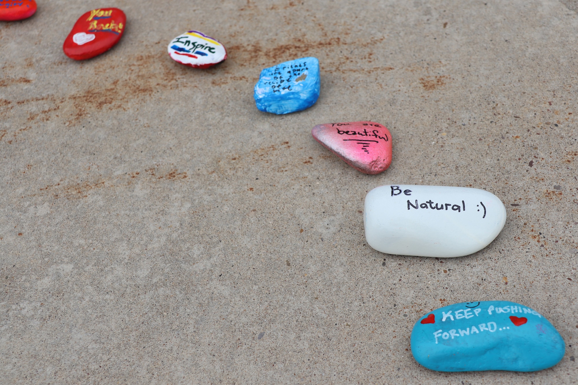 As a result of a resiliency tactical pause, Airmen within the 341st Medical Group painted rocks, varying between inspirational messages or sceneries to encourage positivity and kindness amongst one another.