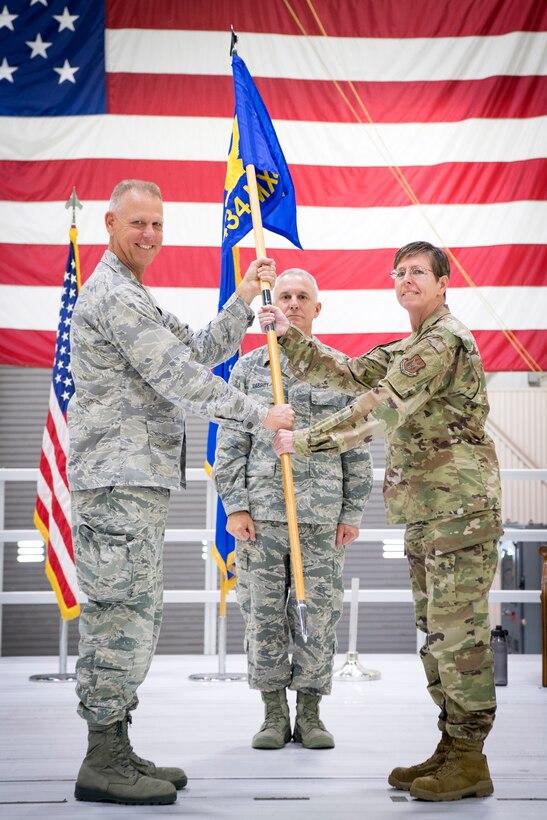 Col. Gretchen Wiltse, 434th Maintenance Group commander, receives the guidon from Col. Larry Shaw, 434th Air Refueling Wing commander, during an assumption of command ceremony at Grissom Air Reserve Base, Indiana Oct. 6, 2019. Wiltse comes to Grissom from Headquarters Air Force Reserve Command, Robins Air Force Base, Georgia, were she served as chief of logistics readiness division. (U.S. Air Force photo/MSgt. Ben Mota)
