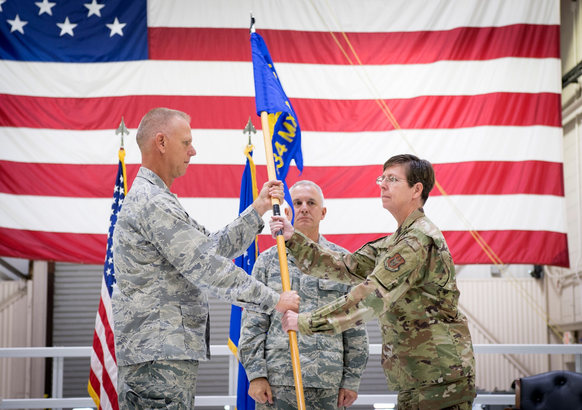 Col. Gretchen Wiltse, 434th Maintenance Group commander, receives the guidon from Col. Larry Shaw, 434th Air Refueling Wing commander, during an assumption of command ceremony at Grissom Air Reserve Base, Indiana Oct. 6, 2019. Wiltse comes to Grissom from Headquarters Air Force Reserve Command, Robins Air Force Base, Georgia, were she served as chief of logistics readiness division. (U.S. Air Force photo/MSgt. Ben Mota)