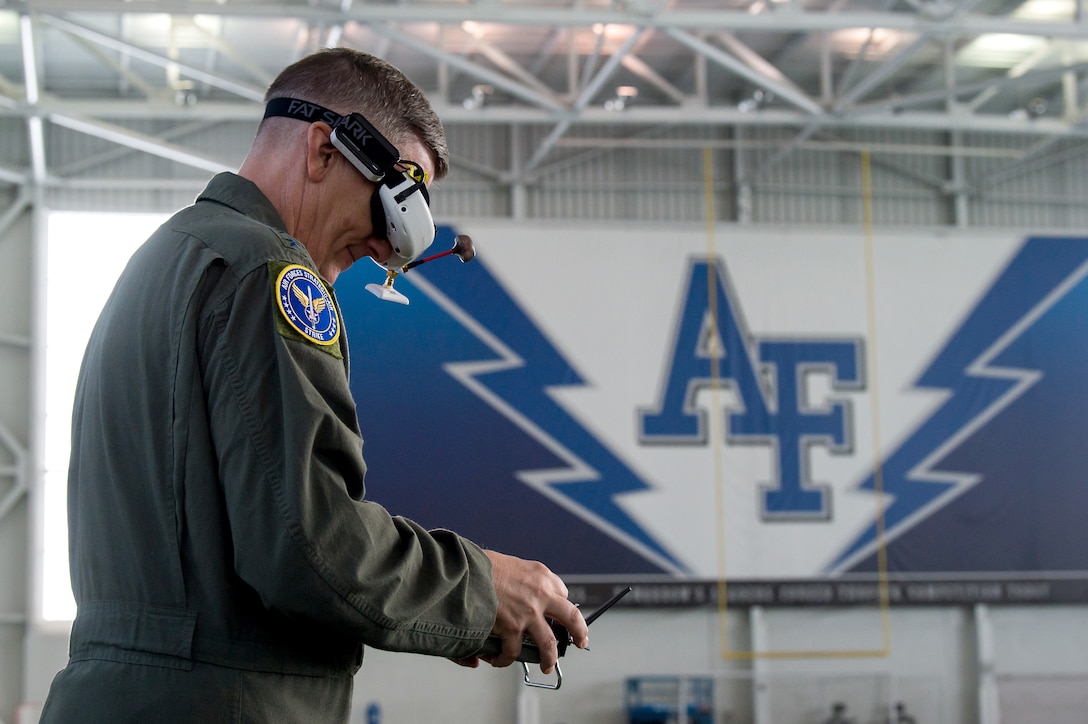 Gen. Tim Ray, Air Force Global Strike Command commander, controls a racing drone during an immersion tour Oct. 2, 2019, at the U.S. Air Force Academy, Colo. As part of Ray’s visit to the Academy, he met with cadets and faculty members involved in the Unmanned Aerial Systems research program. (U.S. Air Force photo by Trevor Cokley)