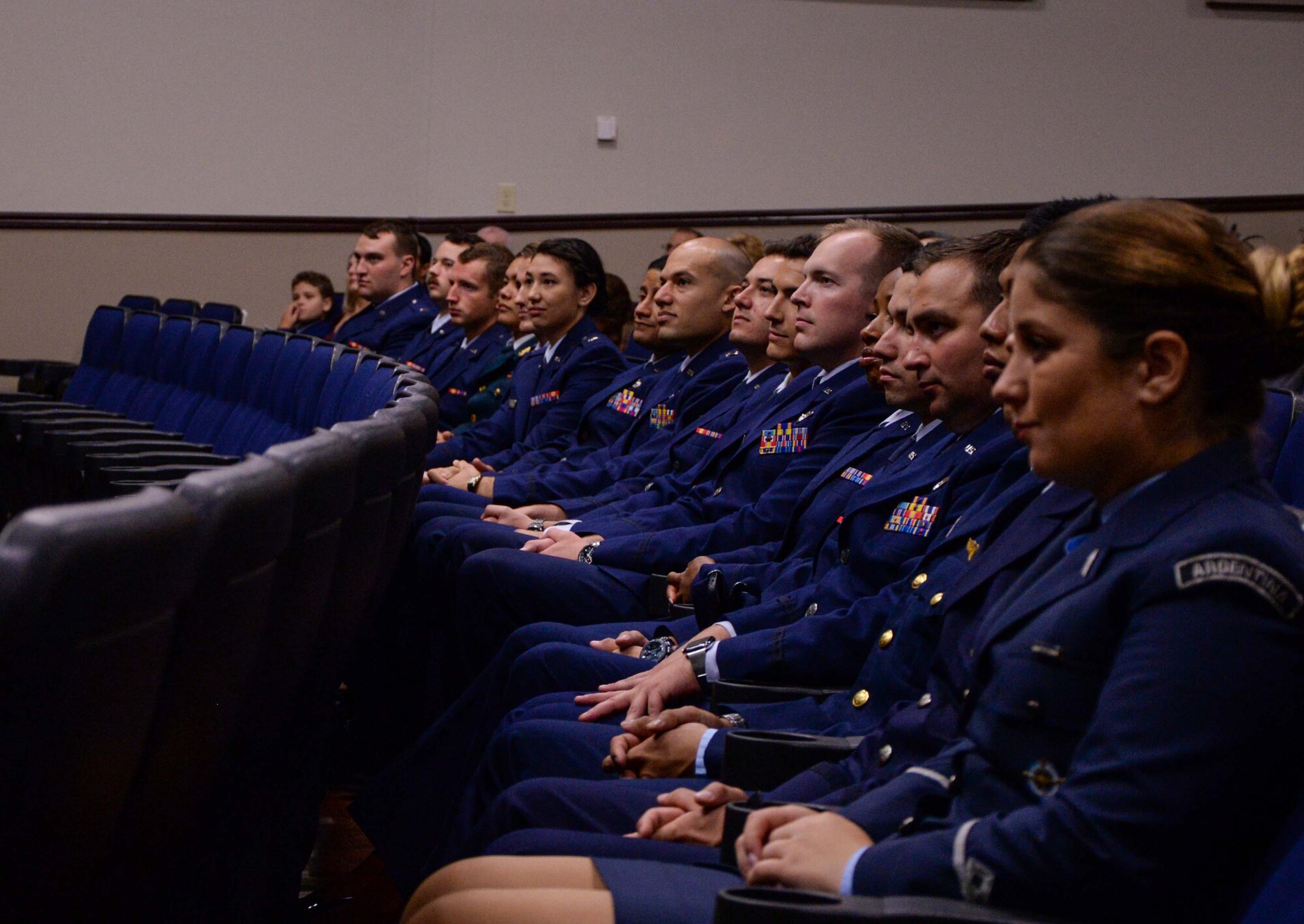 Graduates of Specialized Undergraduate Pilot Training Class 19-25 listen to Col. Steven Boatright, 53rd Weapons Evaluations Group commander, during their graduation ceremony Sept. 27, 2019, at Columbus Air Force Base, Miss. Student pilots train for over a year before graduating from SUPT. (U.S. Air Force photo by Airman Davis Donaldson)